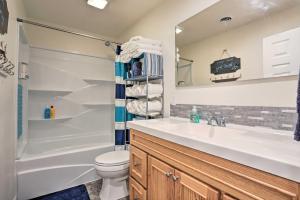 a bathroom with a sink and a toilet and a shower at Lake McConaughy Getaway with Covered Patio in Belmar +16 photos