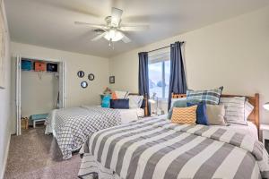 a bedroom with two beds and a ceiling fan at Lake McConaughy Getaway with Covered Patio in Belmar