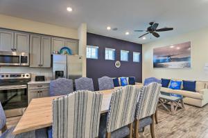 a kitchen and dining room with a table and chairs at Contemporary Home with Hot Tub 4 Mi to Disney Magic in Orlando