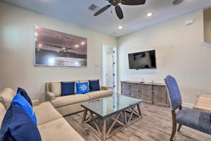 a living room with a couch and a table at Contemporary Home with Hot Tub 4 Mi to Disney Magic in Orlando