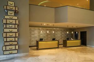 an office with two reception desks and a lobby at Hyatt Regency Merida in M&eacute;rida