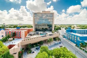 an aerial view of a city with a tall building at Hyatt Regency Merida in Mérida