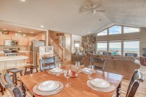 a dining room and living room with a table and chairs at Hubbert Hideaway in Lincoln City