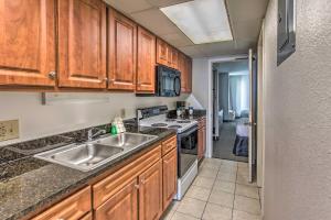 A kitchen or kitchenette at Breezy Landmark Resort Condo with Oceanfront Lanai!