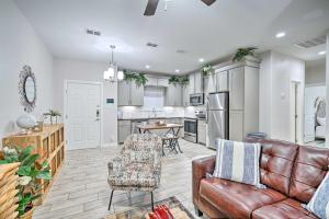 a living room with a couch and a kitchen at Chic Edinburg Escape Hike, Fish, and Explore! in Edinburg
