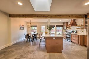 a kitchen and dining room with a table and chairs at 6 Mi to Dtwn Austin Home with Screened Porch and Yard in Austin