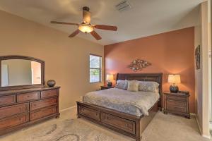 ein Schlafzimmer mit einem Bett und einem Deckenventilator in der Unterkunft Pet-Friendly Tucson Home with Patio and Mountain Views in Tucson