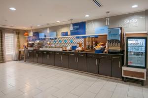 a fast food restaurant with a counter in a store at Holiday Inn Express & Suites Jackson Downtown - Coliseum, an IHG Hotel in Jackson