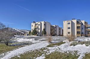 a group of buildings with snow on the ground at Beech Mtn Condo w/ Slope View & Resort-Style Perks in Beech Mountain