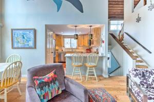 a kitchen and living room with a table and chairs at Chic Village of Loon Getaway Less Than 1 Mi to Ski Slopes! in Lincoln