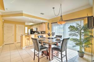 a kitchen and dining room with a table and chairs at Coastal Condo with Pool in South Padre Island! in South Padre Island