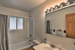 a bathroom with a sink and a shower and a mirror at 16-Acre Modern Fairplay Cabin with Mountain Views! in Fairplay +30 photos