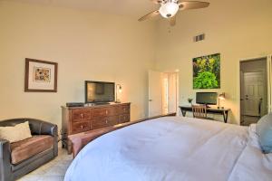 A television and/or entertainment centre at Updated Palm Desert Escape with Resort Amenities!