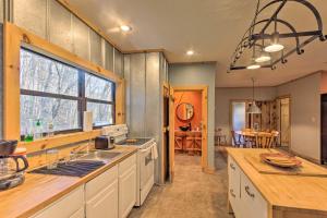 a kitchen with a sink and a counter top at Pet-Friendly Blue Ridge, Cherokee Forest Retreat! in Greeneville