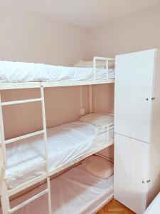 a room with two bunk beds and a closet at Solar Hostel Beach Copacabana in Rio de Janeiro