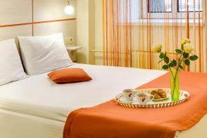 
Кровать или кровати в номере Ордынка гостиница
