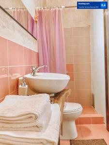 a bathroom with a sink and a toilet and a shower at studio Nick in Kalavrita