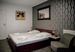 Postel nebo postele na pokoji v ubytování Carnival City Hotel Oradea