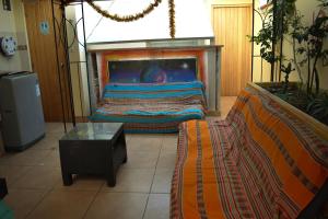 a living room with a bed and a fireplace at Passion Hostel - Barranco in Lima