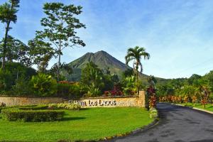 a scenic view of a park with palm trees at Hotel Los Lagos Spa & Resort in Fortuna