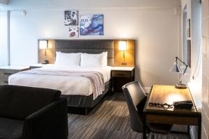 Säng eller sängar i ett rum på Hotel Millwright