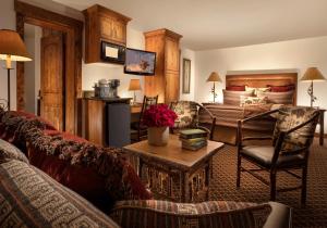 a living room with a couch and a table at Parkway Inn of Jackson Hole in Jackson