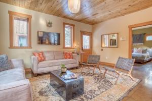 a living room with a couch and a table at The Davenport - Meredith Lodging in Bend
