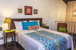 Ліжко або ліжка в номері Villa 14 Santa Ines Antigua Guatemala