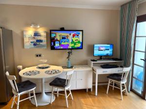 a room with a table and a computer on the wall at Dream View in Adeje