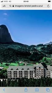 a screenshot of a website with a picture of a building at Cond VISTA AZUL in Pedra Azul