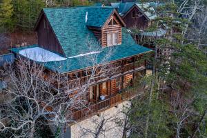 an overhead view of a house with a green roof at FALL SPECIAL! NERF Party, Pool, HotTub, Pet Friendly in Sevierville