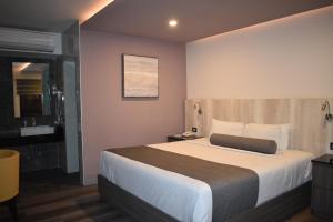 Voodi või voodid majutusasutuse Hotel Frontiere Tijuana toas