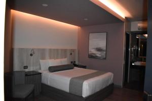 Voodi või voodid majutusasutuse Hotel Frontiere Tijuana toas