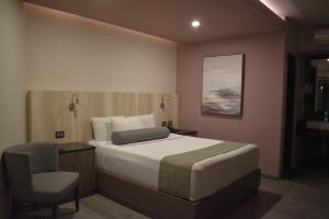 Voodi või voodid majutusasutuse Hotel Frontiere Tijuana toas