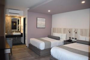 Voodi või voodid majutusasutuse Hotel Frontiere Tijuana toas