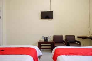Postel nebo postele na pokoji v ubytování RedDoorz @ Hotel Citra Indah