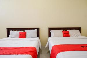 Postel nebo postele na pokoji v ubytování RedDoorz @ Hotel Citra Indah