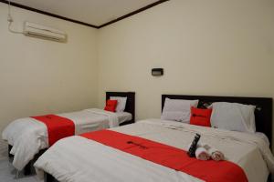 Postel nebo postele na pokoji v ubytování RedDoorz @ Hotel Citra Indah