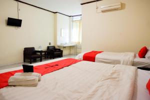 Postel nebo postele na pokoji v ubytování RedDoorz @ Hotel Citra Indah
