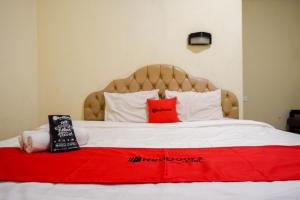 Postel nebo postele na pokoji v ubytování RedDoorz @ Hotel Citra Indah