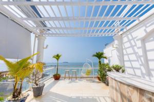 a balcony with a view of the ocean at Homestay coco in Vung Tau
