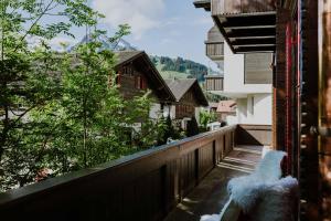 a balcony of a building with a view of a building at Ferienwohnung im Chalet Alpenrose in Adelboden