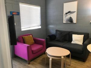 
a living room filled with furniture and a couch at Esperance Central Accommodation in Esperance
