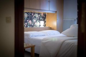 Posteľ alebo postele v izbe v ubytovaní Inn Aosta Apartments
