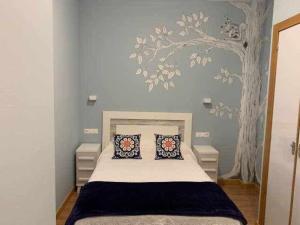 Postel nebo postele na pokoji v ubytování Cumbres de los Picos Apartamento Urriellu