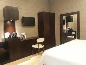 Postel nebo postele na pokoji v ubytování Alsalam Syariah Guesthouse
