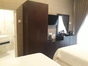 Postel nebo postele na pokoji v ubytování Alsalam Syariah Guesthouse