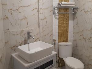 Koupelna v ubytování Alsalam Syariah Guesthouse