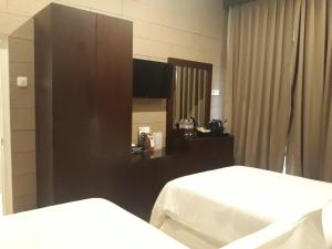 Postel nebo postele na pokoji v ubytování Alsalam Syariah Guesthouse