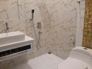 Koupelna v ubytování Alsalam Syariah Guesthouse